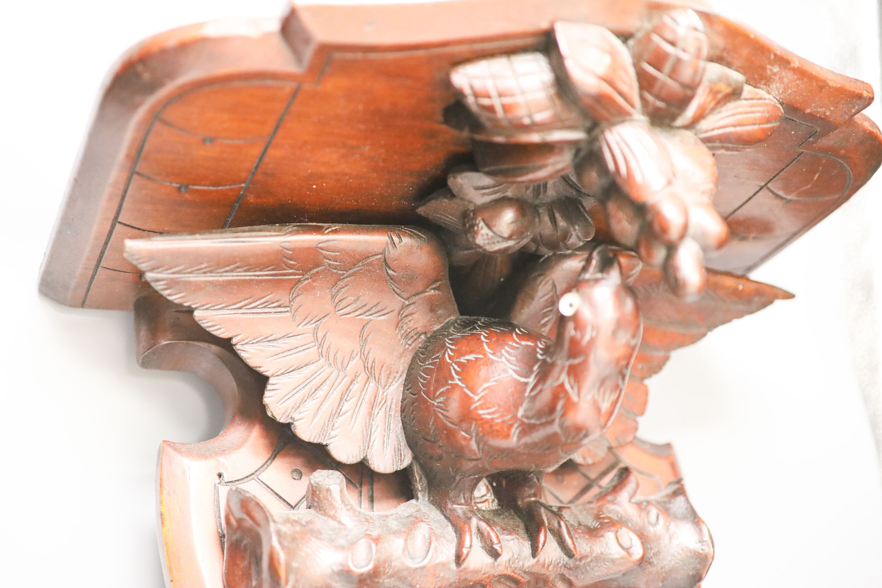 A late 19th century carved mahogany ‘eagle’ wall bracket with glass eyes 51cm